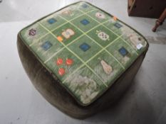 A vintage tapestry topped and dralon footstool