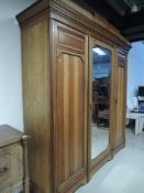 A Victorian mirror door wardobe, triple section width approx. 220cm