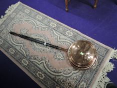 A wooden and copper bodied bed warming pan