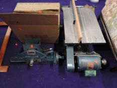 A vintage belt driven bench saw and accesories