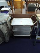 A vintage brass tea trolley, with Eternal beau design