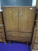 A vintage sapele 'tallboy' with double cupoboard over two drawer base, width approx. 76cm, height