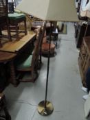 A vintage brass standard lamp