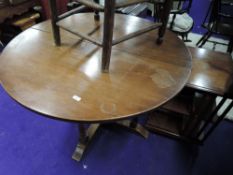 A solid oak extendable dining table on central frame work