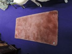 A vintage pink rug, deep shag pile, approx. 150cm x 80cm