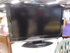 A Sharp Aquos 32' LCD TV, model number LC-32AD5E-BK