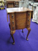 A reproduction walnut bedside chest on chest of three drawers, approx height 69cm