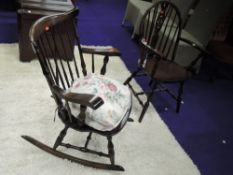 A traditional wheel back carver chair and a similar spindle back rocking chair
