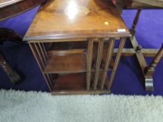 A reproduction mahogany revolving bookcase in the Edwardian style