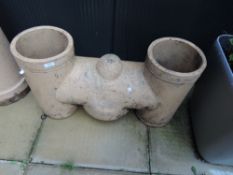 A traditional clay twin chimney pot