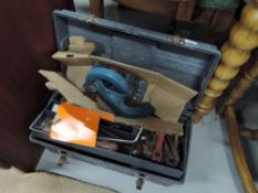 A toolbox and contents including Black and Decker power saw parts