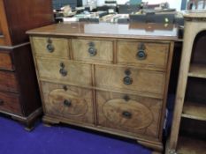 An early 20th Century mahogany chest of three over two over two cellarette style drawers