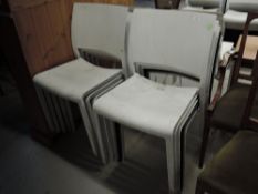 Ten moulded plastic chairs , nine white and one black, similar to lot 753