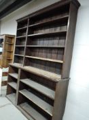 A large rustic part oak library or workshop shelf unit, width approx. 180cm height 230cm