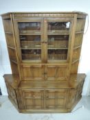 A modern mid stain Ercol (Old Colonial or similar) sectional lounge unit, overall width approx.