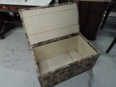 A vintage bedding box, having upholstered top