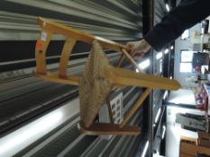 A vintage beech frame child's chair having rush seat