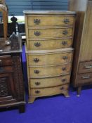 A reproduction walnut dwarf chest on chest of three over four drawers, approx height 110cm x 54cm
