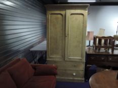 A Victorian bleached scumbled wardrobe on drawer base
