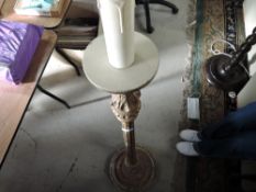 A gilt effect wooden standard lamp in the classical style