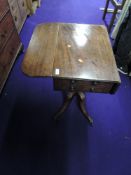 A 19th Century mahogany pembroke style table on turned pedestal base with quadruple splay legs on