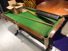 A vintage miniature snooker table 130 x 72cm, labelled Harold Holt, Blackpool, with accessories (