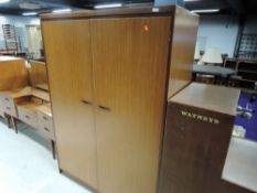 A vintage teak effect wardrobe, similar to G plan, matches lots 697, 698 and 699
