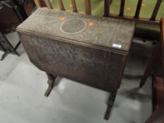 A 19th Century carved drop leaf occasional table, width approx. 62cm