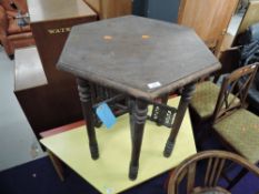 An Antique stained frame hexagonal occasional table on bobbin frame