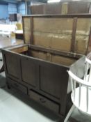 A period oak kist having three panel over double drawer base, dimensions approx. W122cm D52cm H78cm