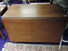 An early 20th century drop leaf mahogany dining table
