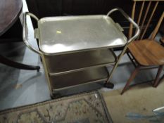 A vintage brass effect tea trolley