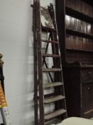 A set of vintage wooden decorators ladders