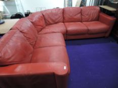 A vintage style red leather corner settee, approx. 230 x 230cm (has fire regs label)