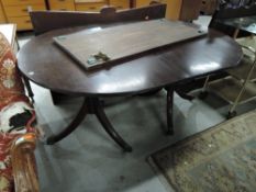 A Regency style extending dining table, nice quality on brass claw feet and casters, 1 additional