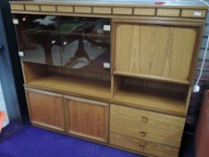A vintage teak effect laminate wall unit, dimensions approx. W150cm H130cm