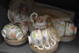 A Victorian part tea service having extensive enamel detailing approx 28 pieces including slop