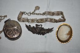A small selection of HM silver and white metal jewellery including a locket, cameo brooch, filligree