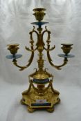 A French style Candelabra having ormolu decoration with enamel detailing, purportedly from Beatrix