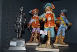 A set of three muketeer figures and similar pewter Bed Fanklin