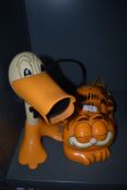 A vintage novelty telephone set of Garfield the cartoon cat and similar Duck n Dry