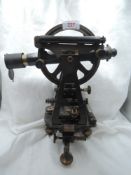 A vintage surveyors theodolite having brass fitments uncased