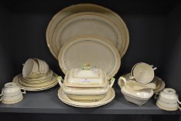 A collection of Crescent ivory, includes platters,tureen,plates,gravy boat and cups and saucers,