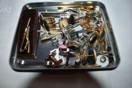 A small selection of gents tie clips and cufflinks