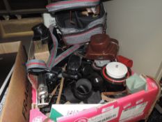 A selection of photography and film equipment including cameras stand and lens etc