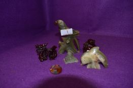 A selection of small stone carved figures including parrot Buddah and agate ring
