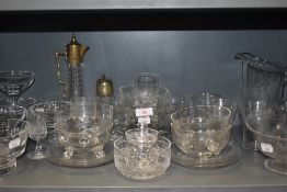 A selection of clear cut and crystal glass wares including antique claret jug and sugar castor