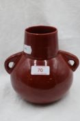 A red Ruskin/Bretby style squat vase having handles to sides.