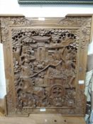 A hand carved ethnic wood Indian panel depicting Hanuman
