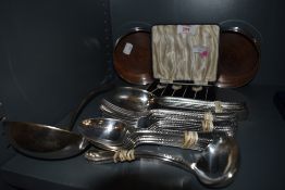 A small selection of silver plate including cased set of coffee spoons, pair of bottle coasters